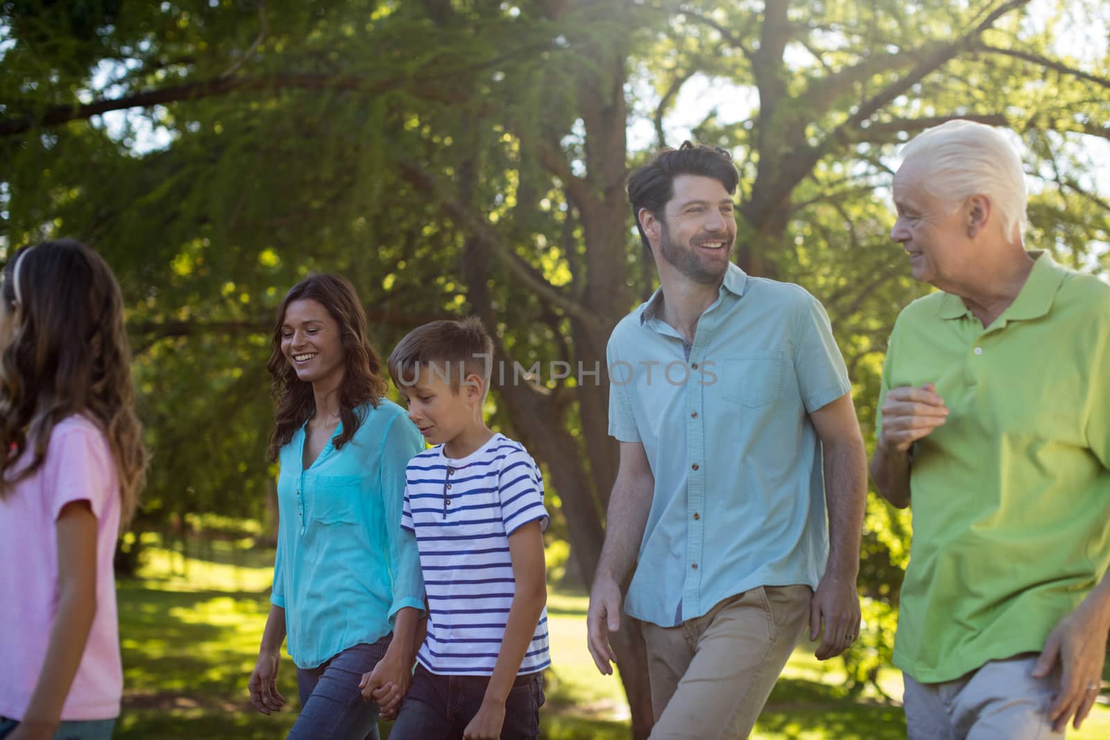 Happy family enjoying in park by Wavebreakmedia