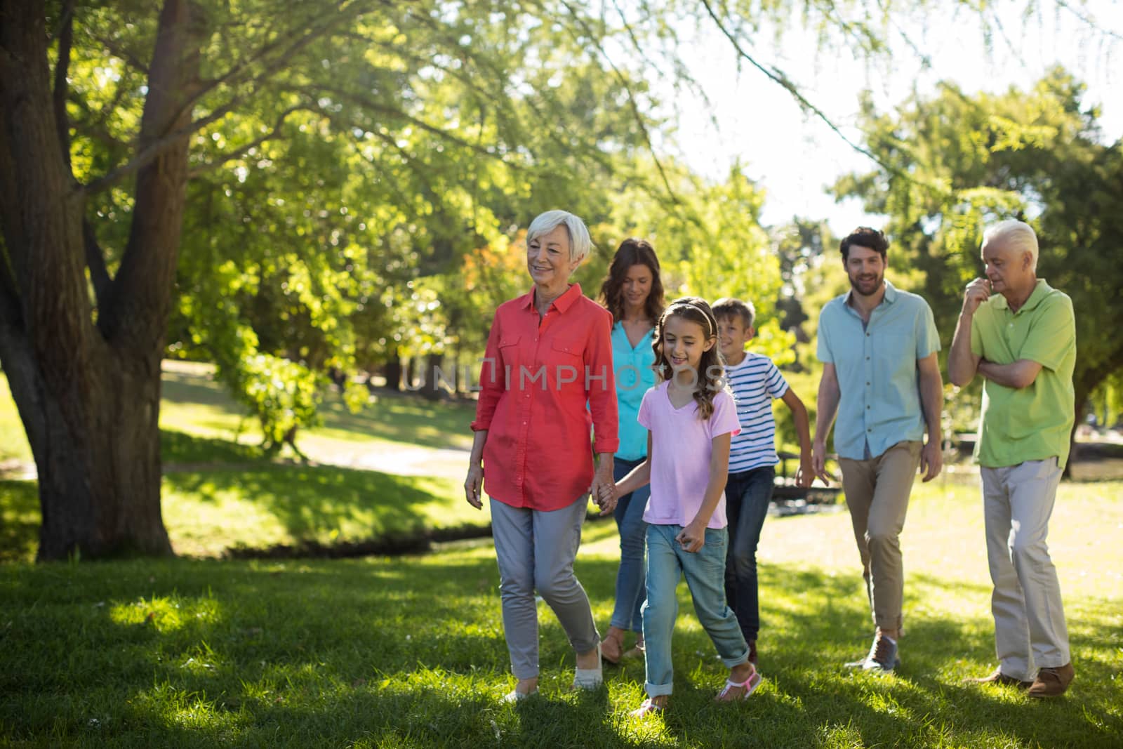 Happy family enjoying in park on sunny a day