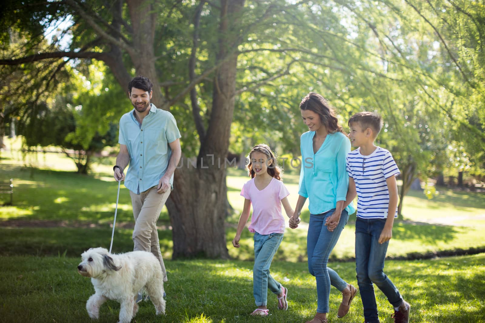 Happy family enjoying in park on sunny a day