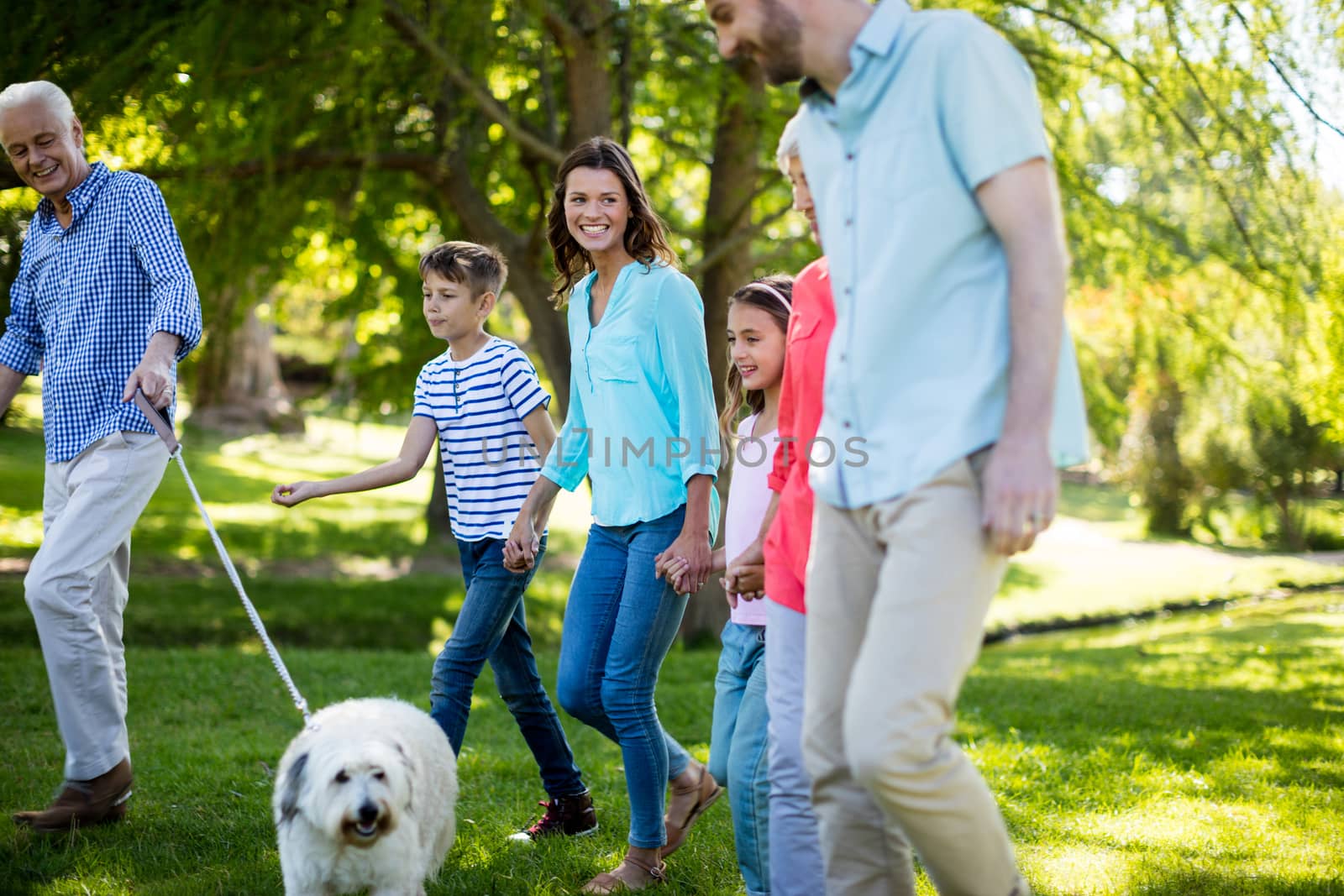 Happy family enjoying in park on sunny a day