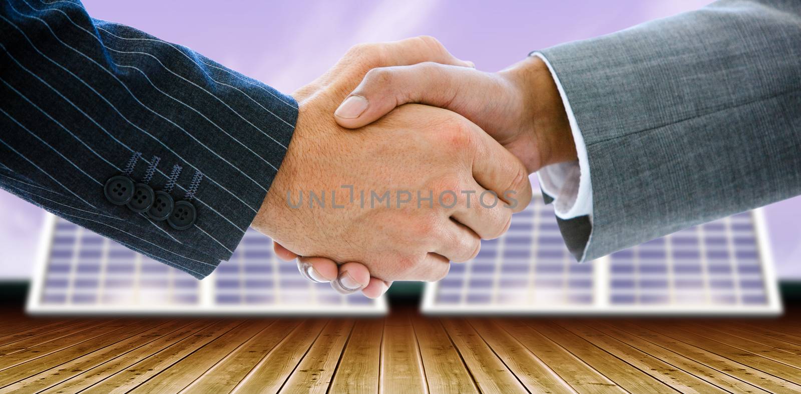 Composite image of business people shaking hands by Wavebreakmedia