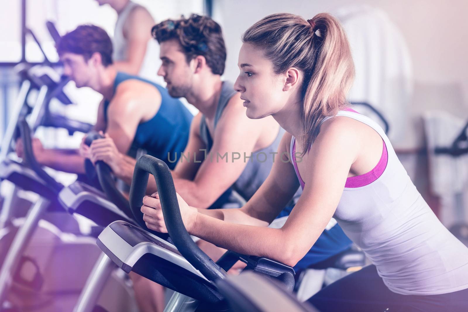 Fit people doing exercise at gym