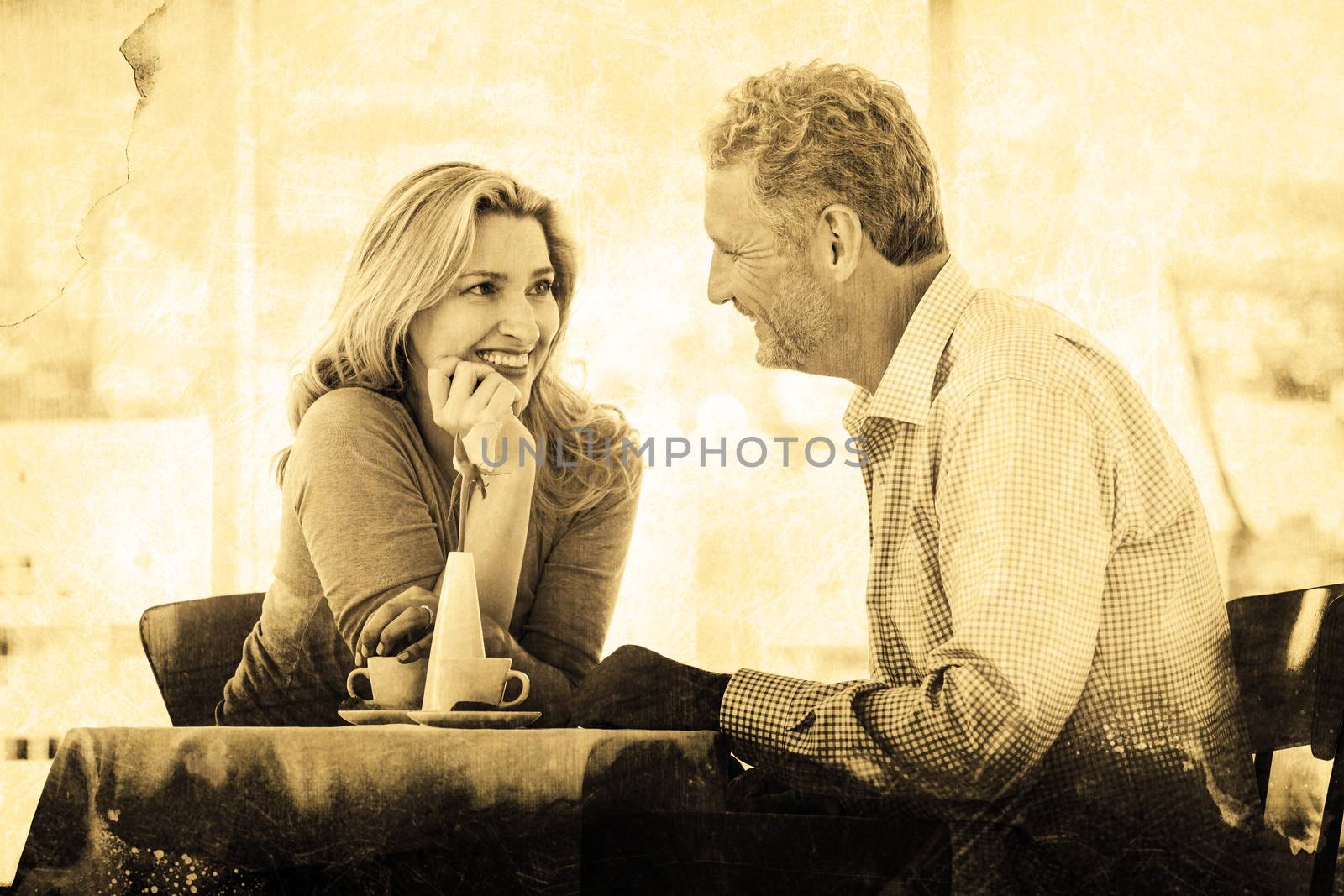 Grey background against romantic couple sitting in restaurant