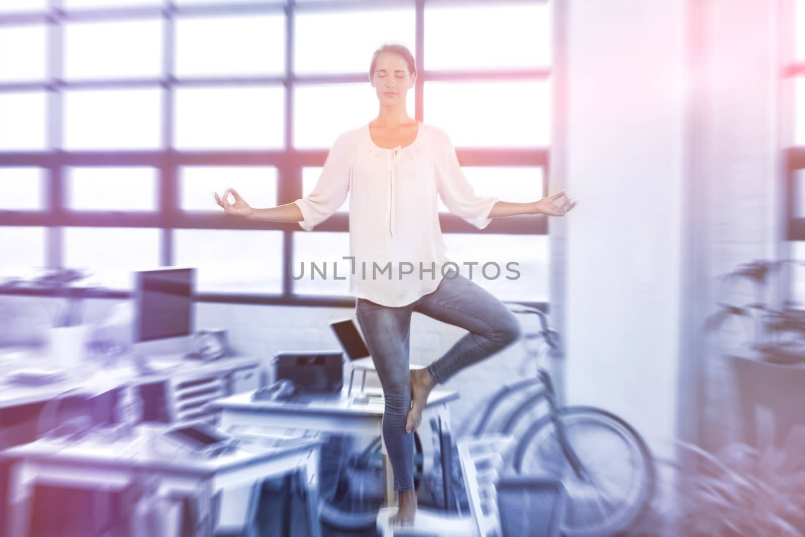 Female business executive performing yoga by Wavebreakmedia