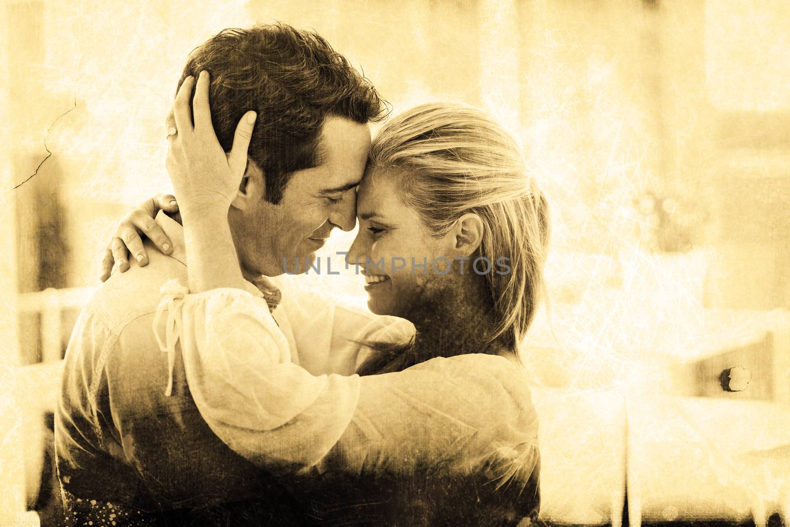 Grey background against romantic couple embracing at home