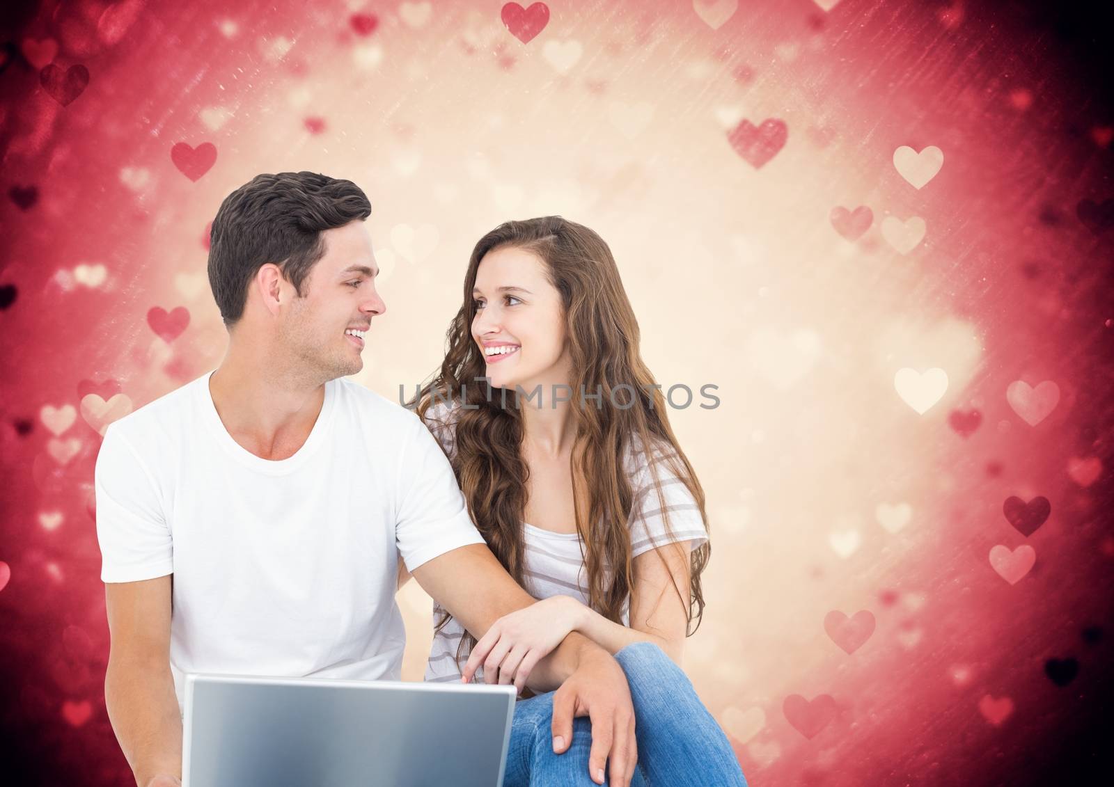 Romantic couple sitting together against digitally generated background
