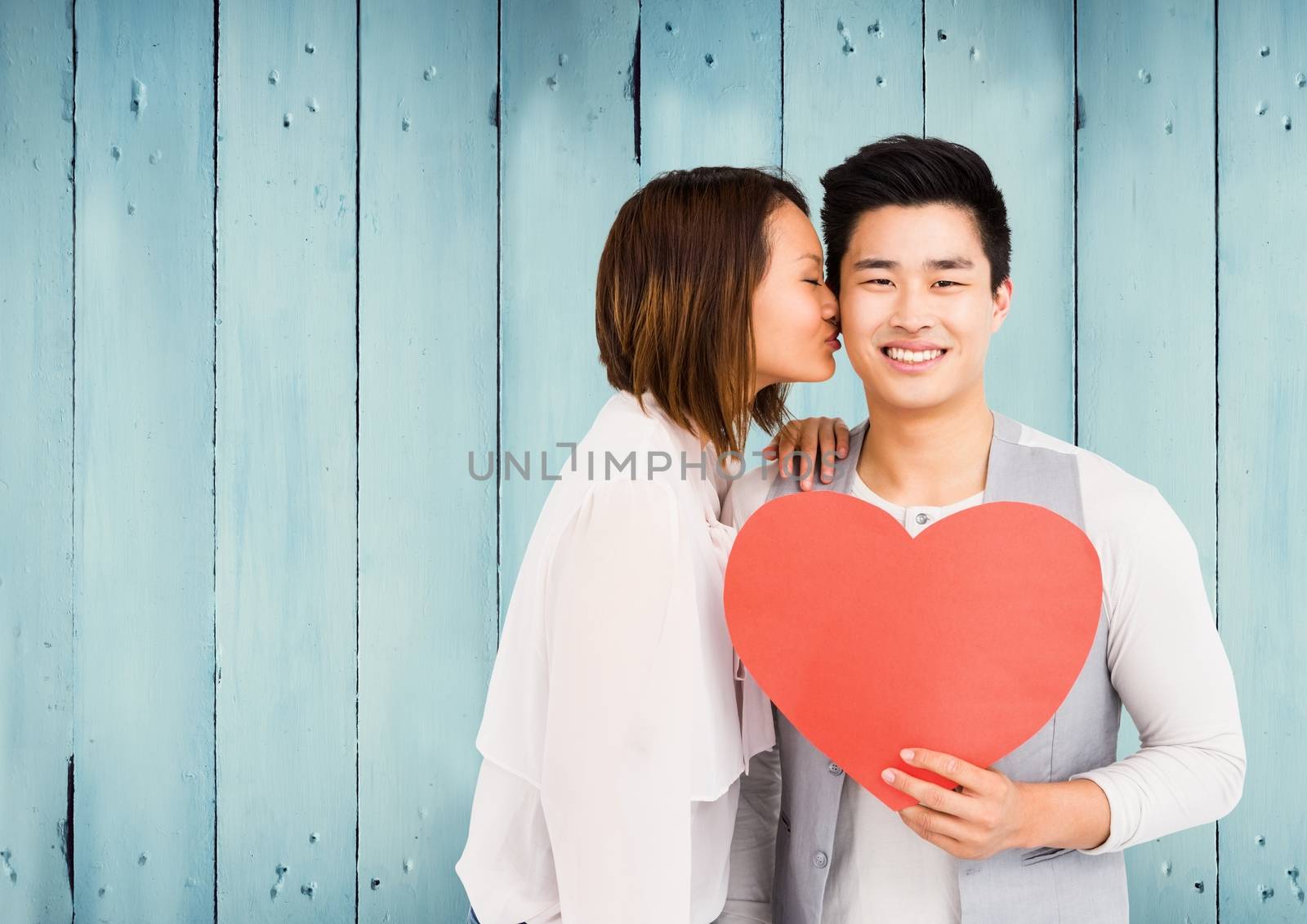 Romantic couple holding heart shape by Wavebreakmedia