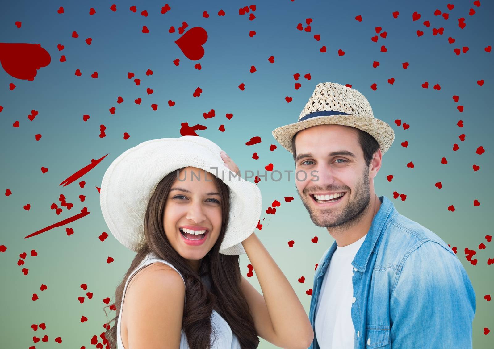 Romantic couple having fun against blue background with hearts
