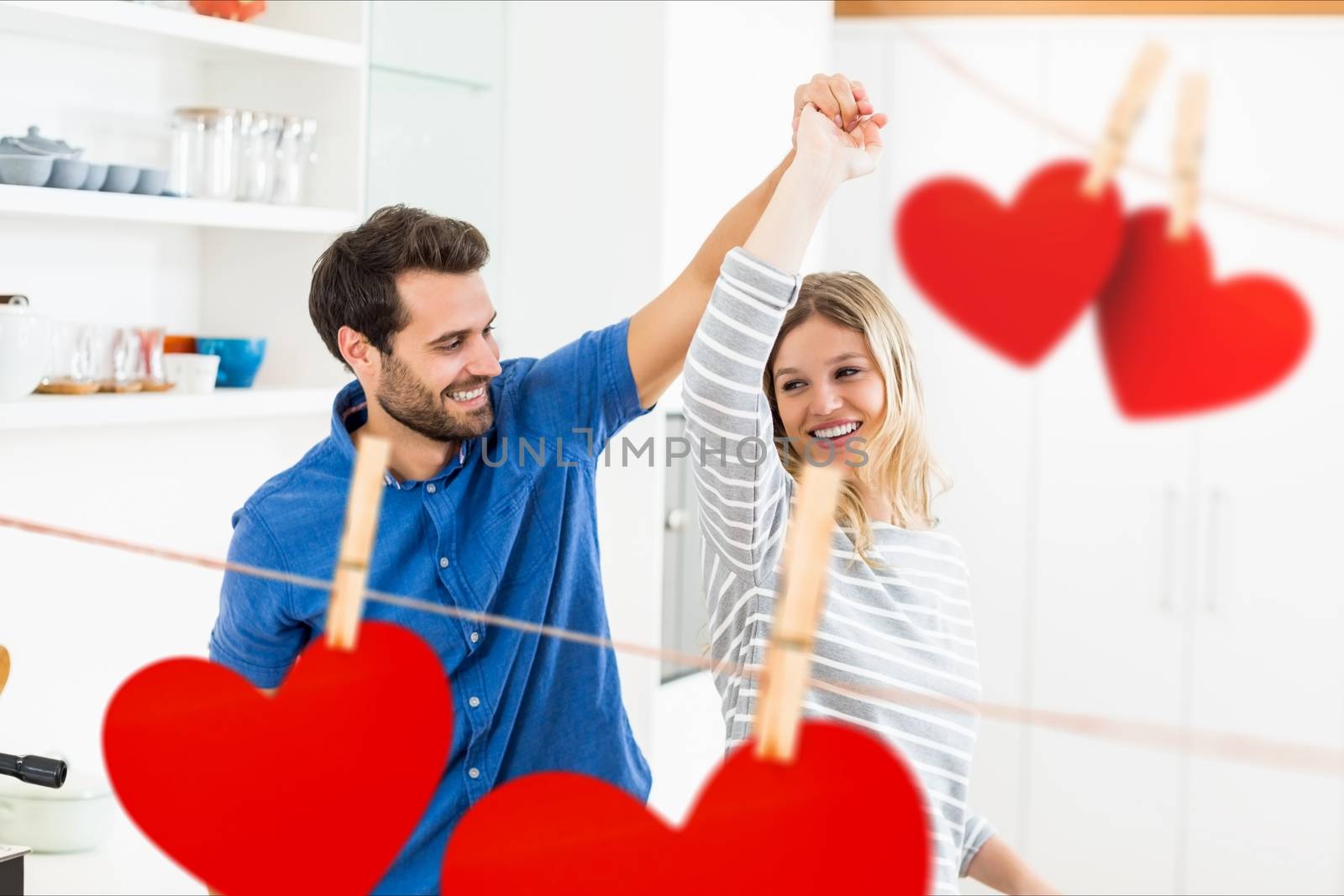 Romantic couple dancing at home by Wavebreakmedia
