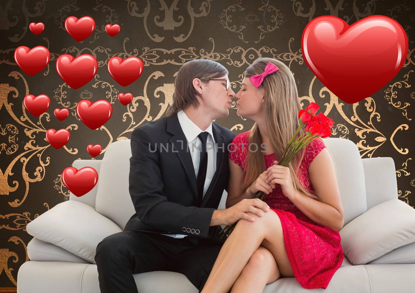 Romantic couple in love while sitting on a sofa against digitally generated background