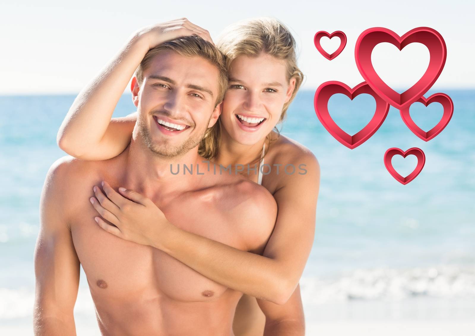 Composite images of romantic couple embracing on beach with heart shapes