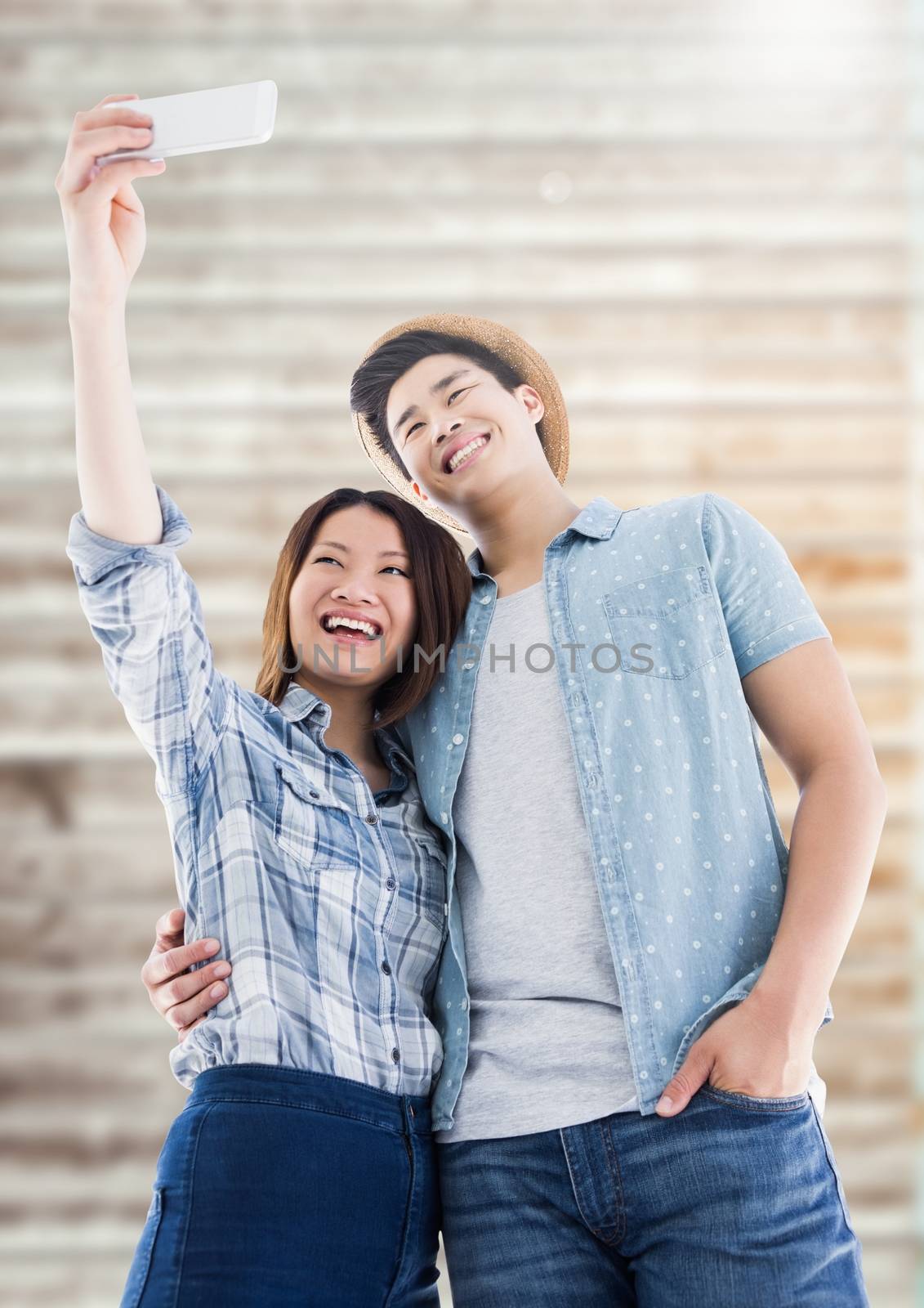 Couple taking selfie from mobile phone by Wavebreakmedia