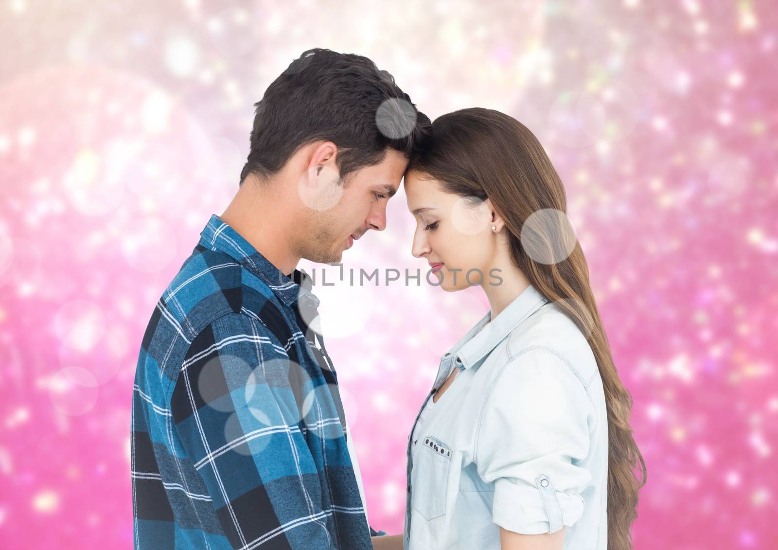 Composite image of romantic couple embracing each other against bokeh background