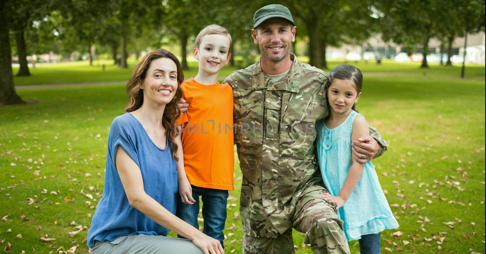 Soldier reunited with their family in park