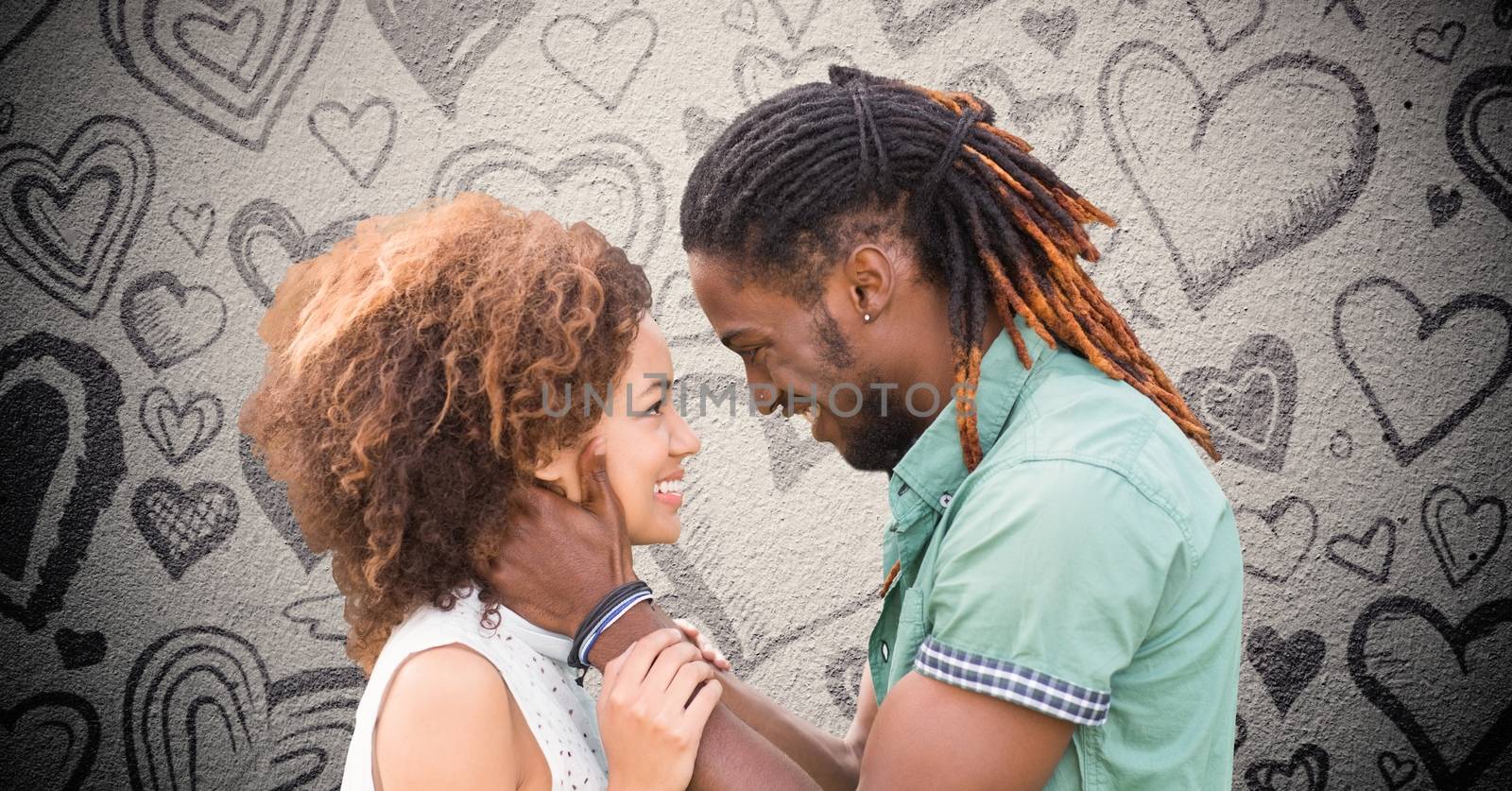Romantic couple against grey background  by Wavebreakmedia