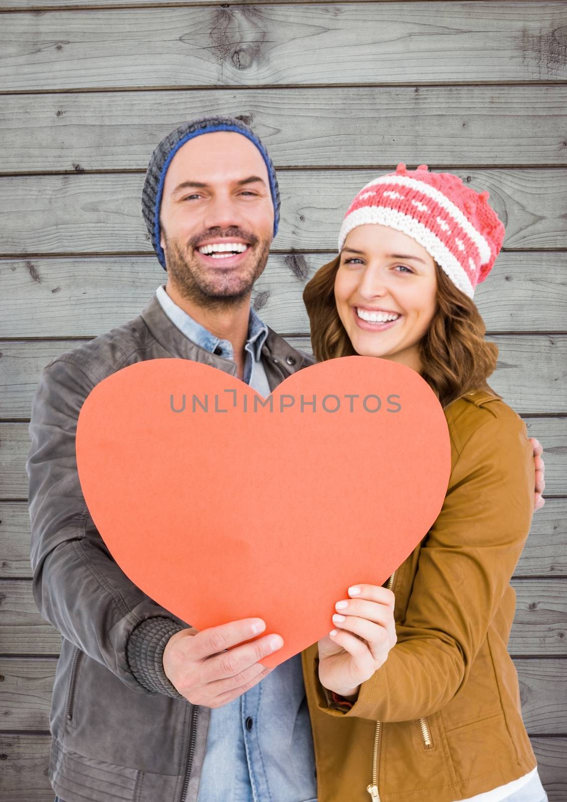 Romantic couple holding a heart by Wavebreakmedia