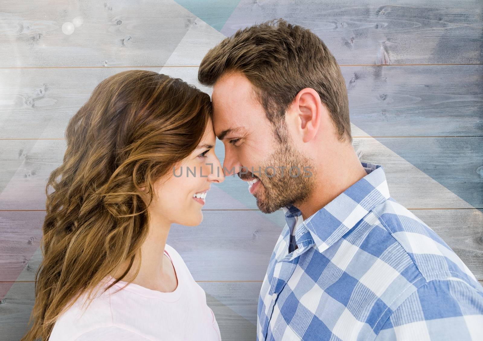 Romantic couple in love against wooden background