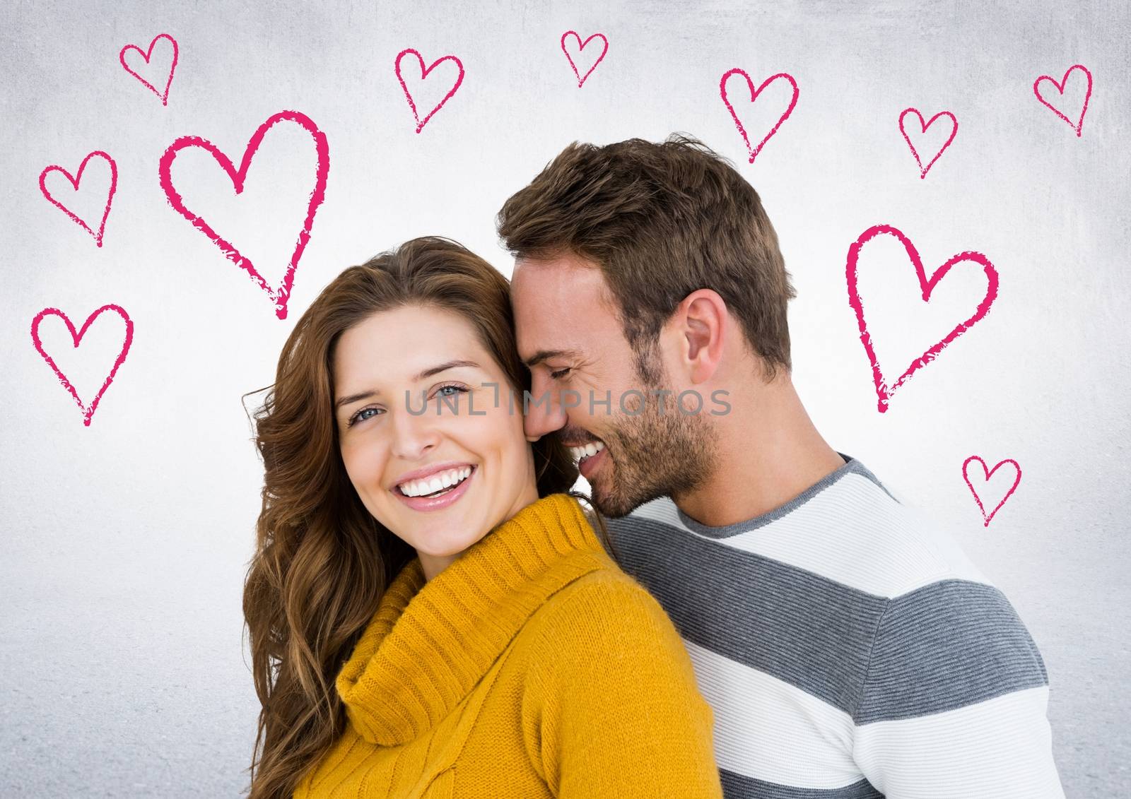 Romantic couple embracing against digitally generated heart background