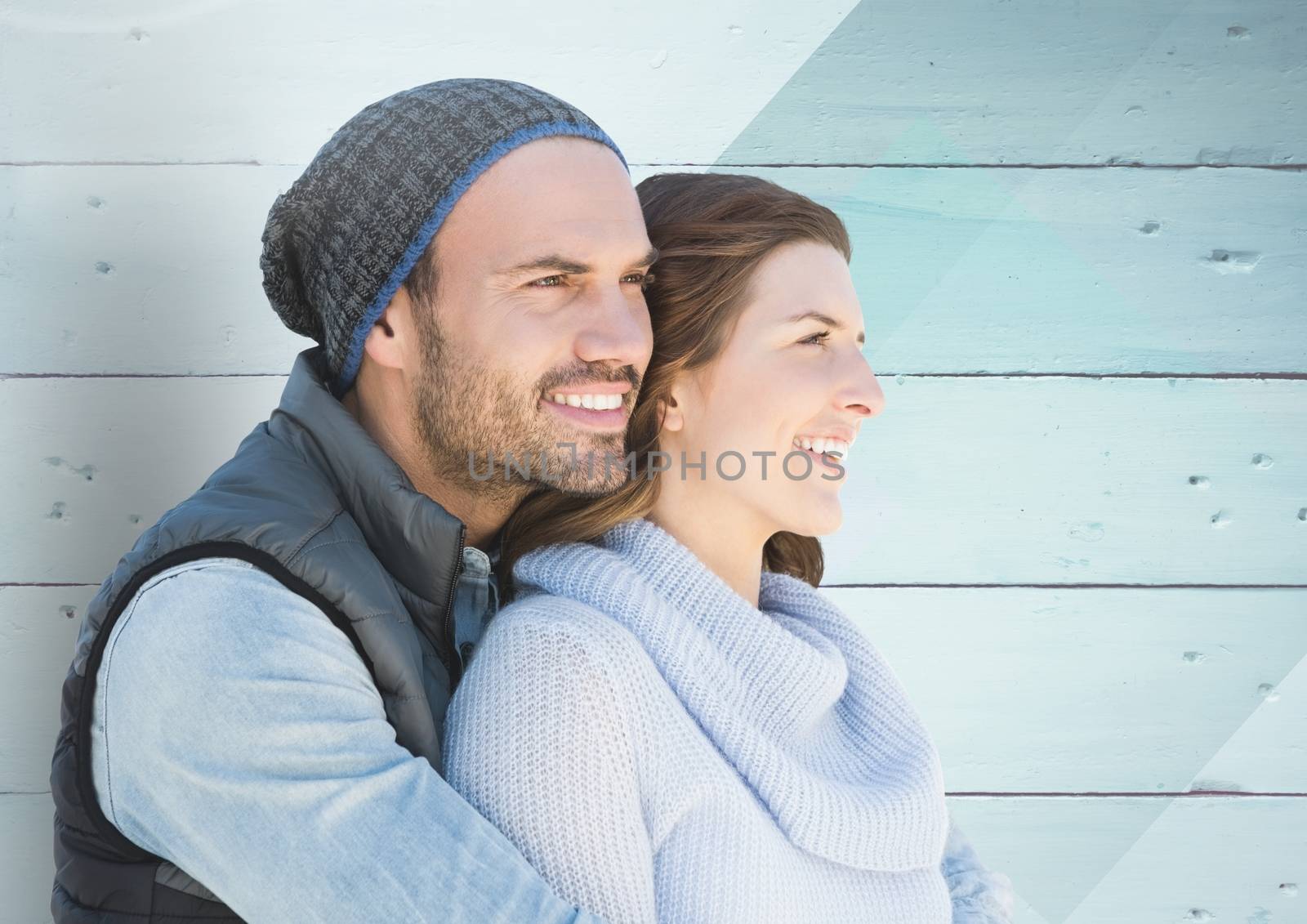 Composite image of couple against wood background