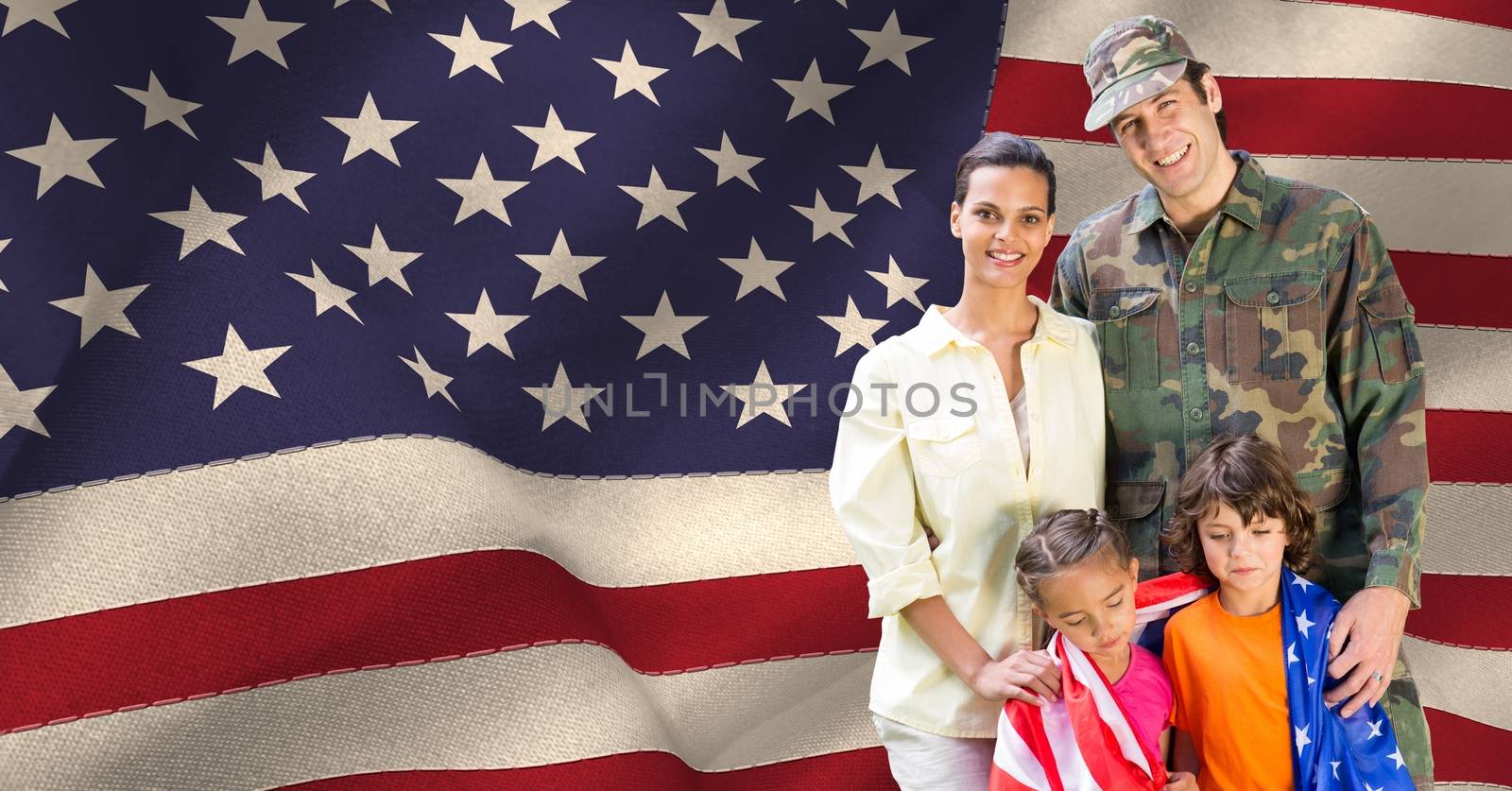 Portrait of happy family standing against american flag