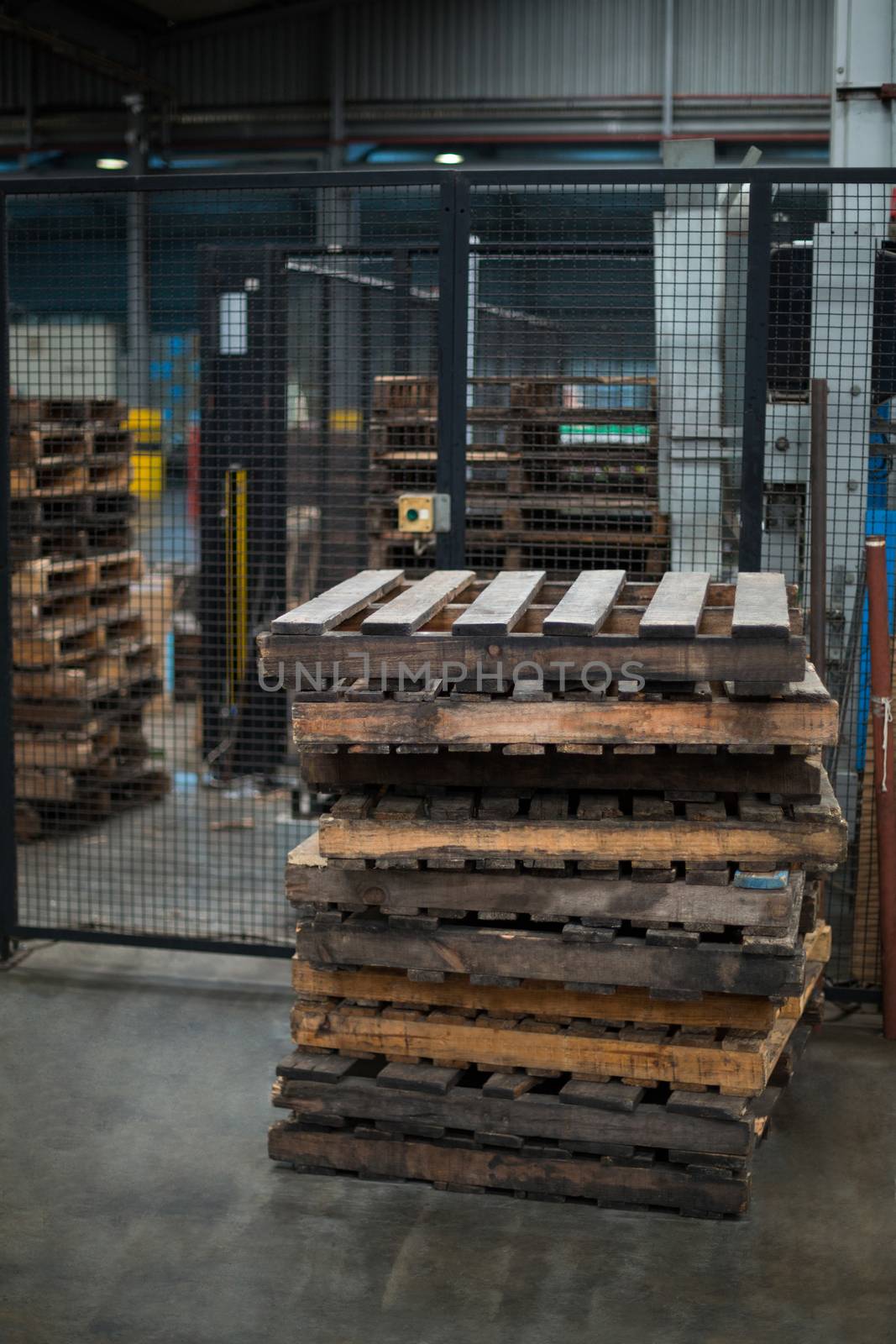 Stack of wooden pallets in bottle factory