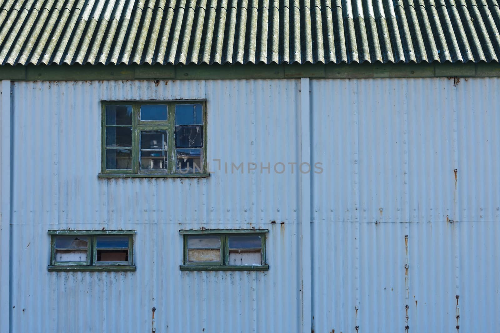 Old blue tin boathouse near the town wharf, Simon's Town, South Africa