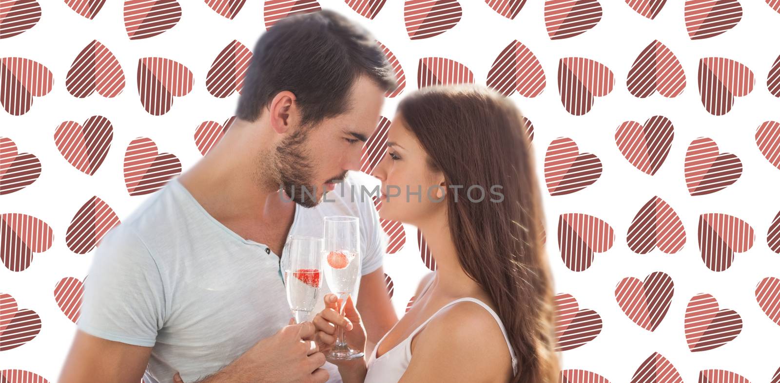 Young couple looking each other against background with hearts