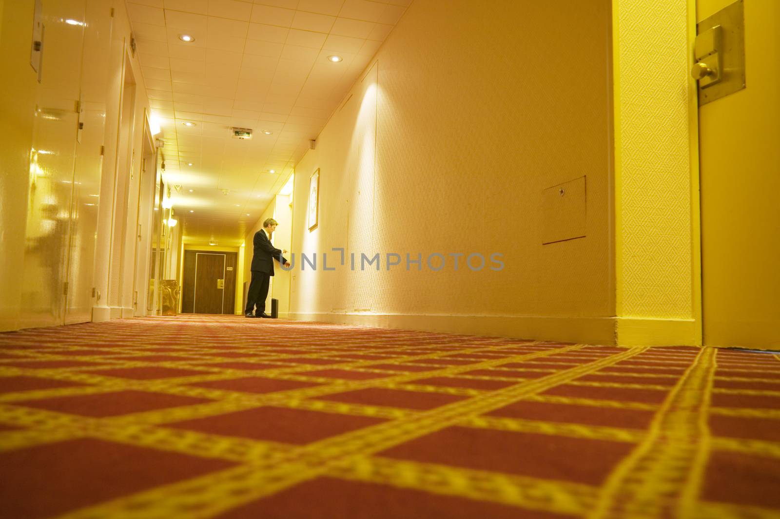 A businessman checking in to hotel themes of travel working late arrival