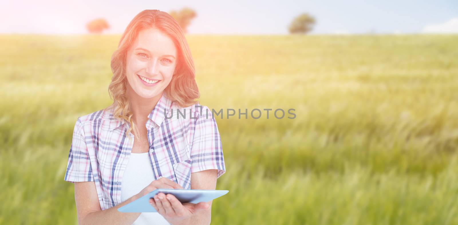 Composite image of pretty hipster using tablet  by Wavebreakmedia