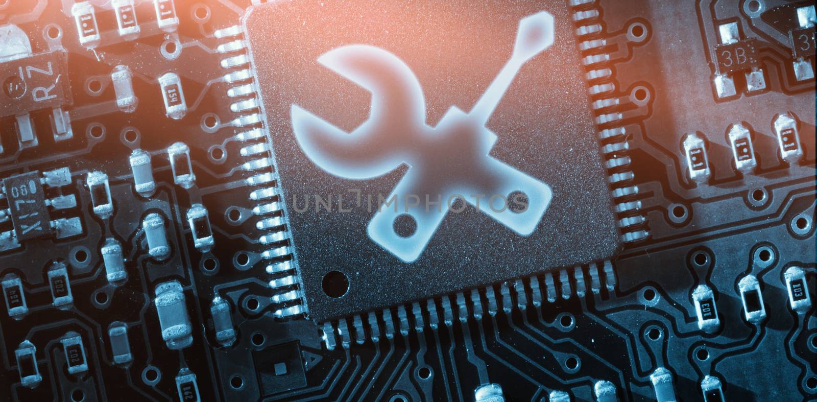 Digitally generated image of spanner and screwdriver against green and black electronic circuit