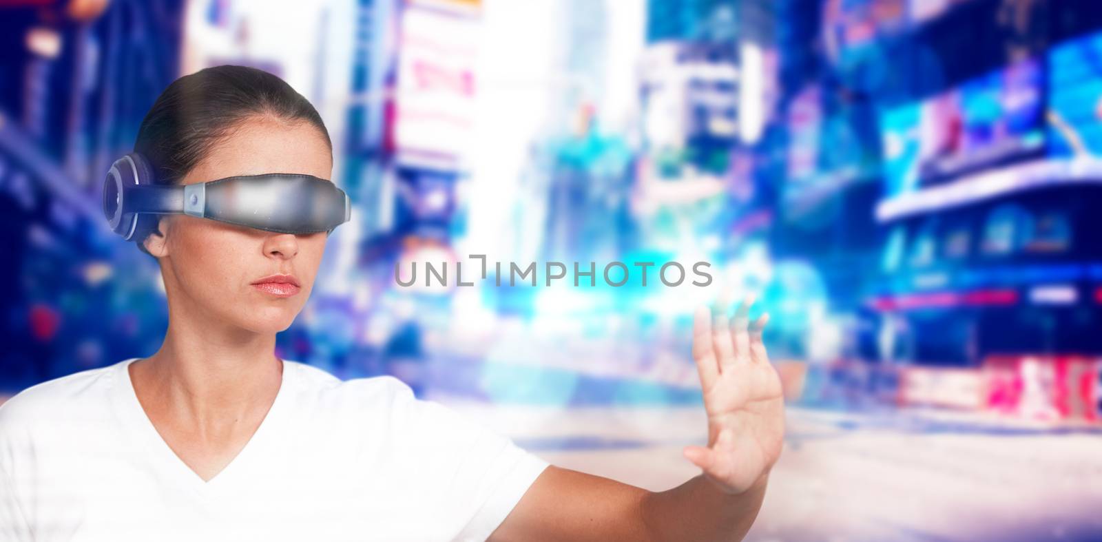 Beautiful woman gesturing while using virtual video glasses against blurry new york street
