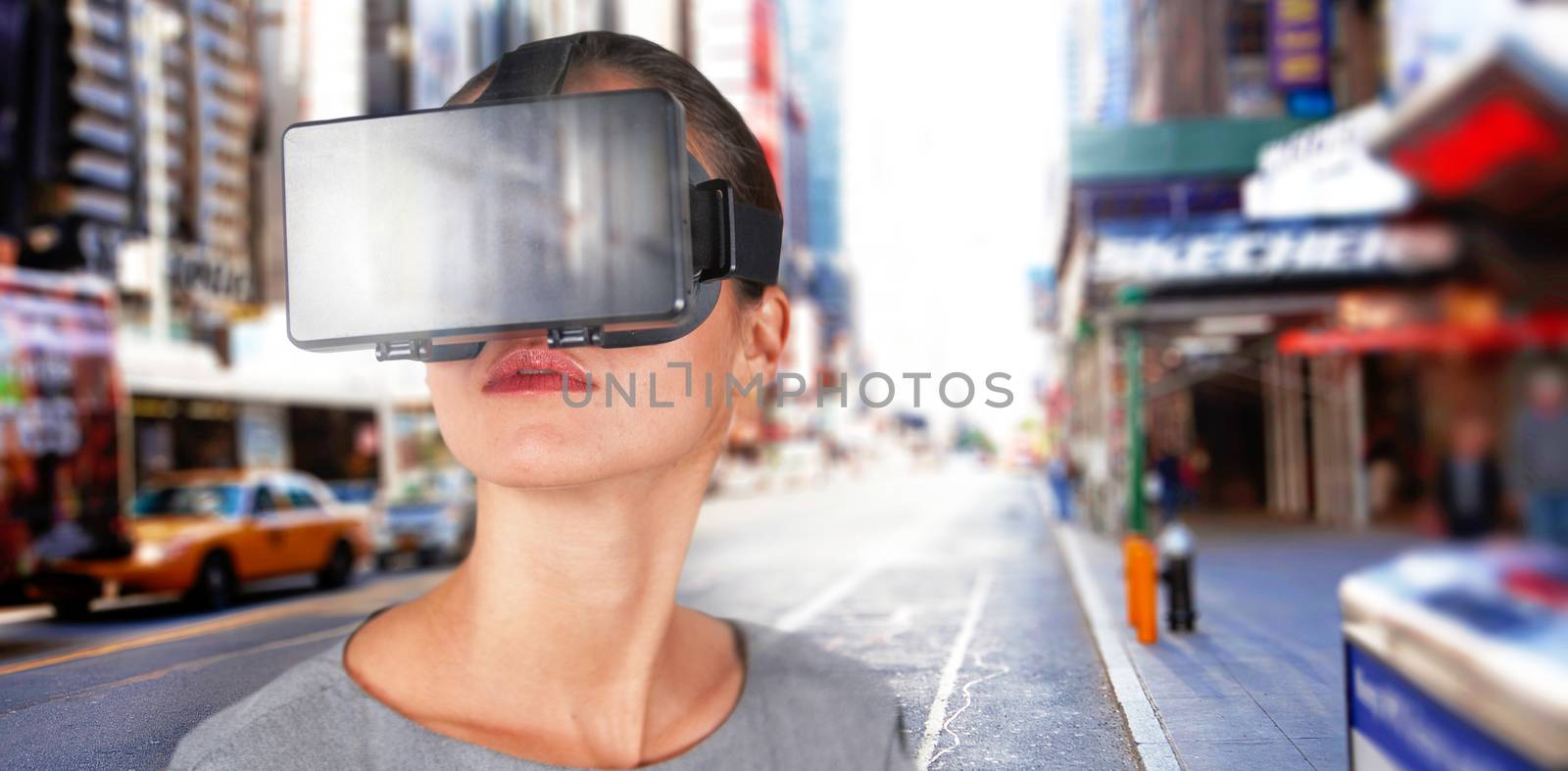Close up of woman using virtual reality simulator against blurry new york street