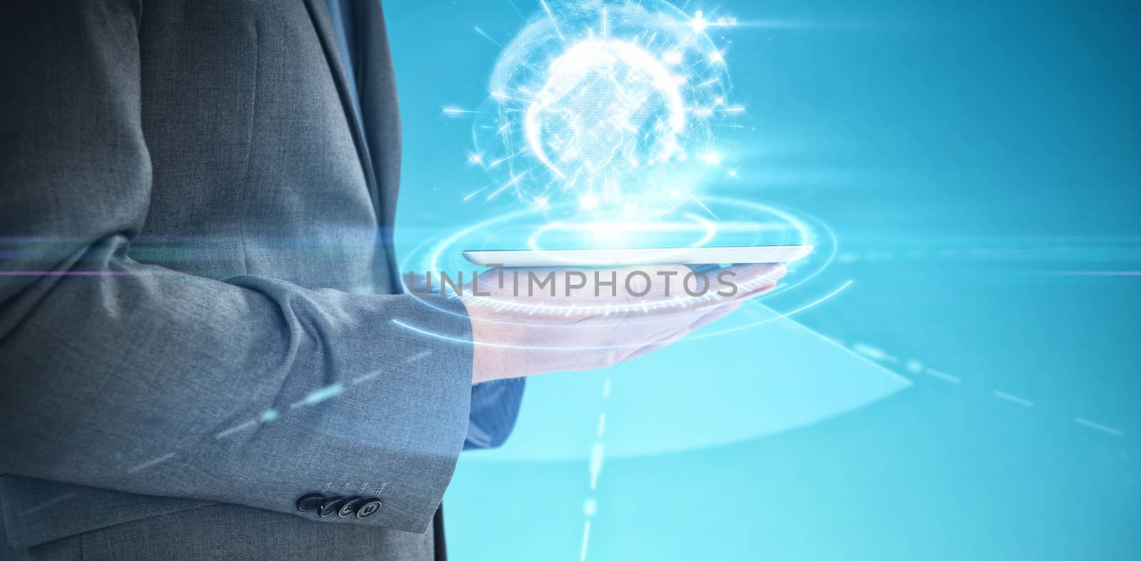 Businessman holding a digital tablet against blue vignette background