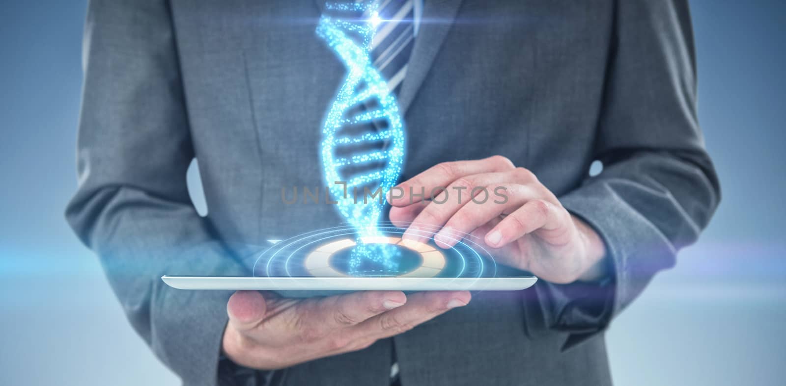 Businessman using digital tablet against digitally generated image of illuminated volume knob with dna strand