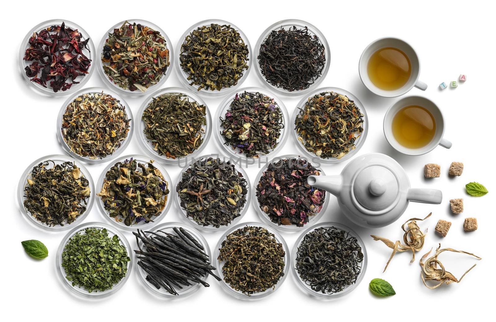 Large assortment of tea on a white background. The view from the top.