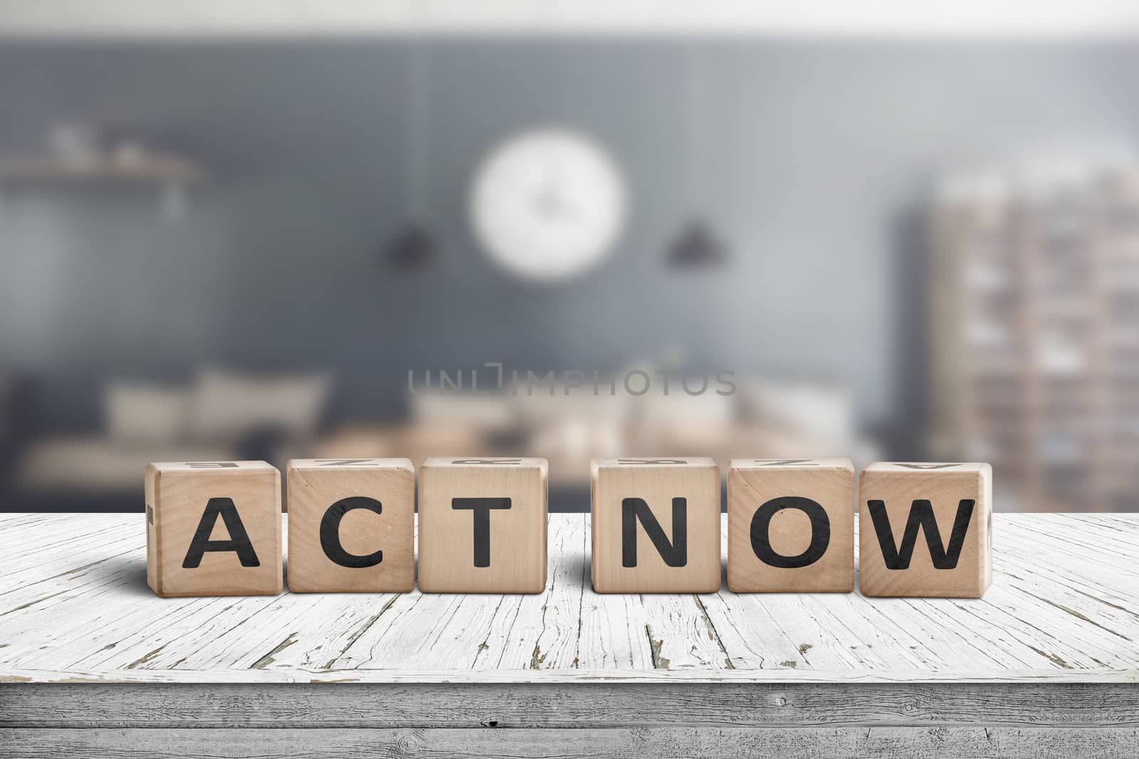 Act now message sign on a wooden desk by Sportactive