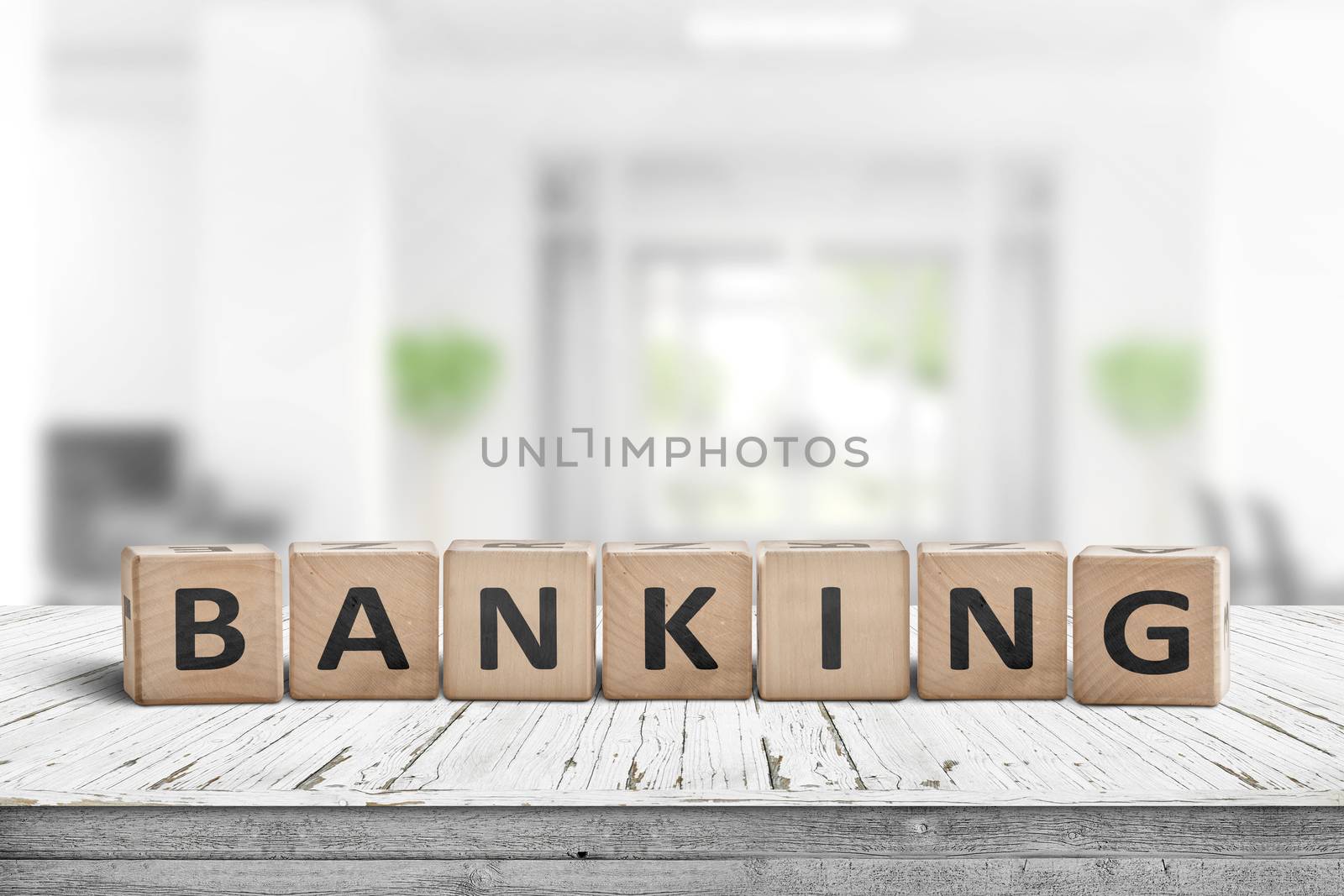 Banking sign on a wooden desk in a bright work environment