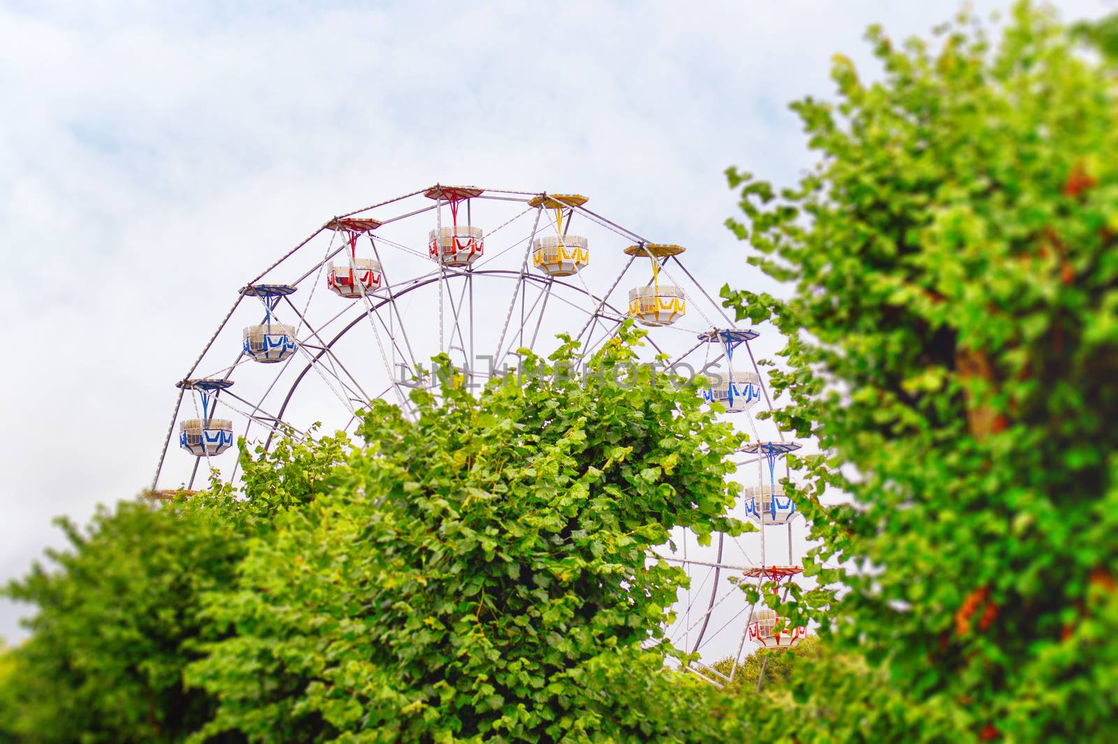 Amusement park with a ferris wheel by Sportactive