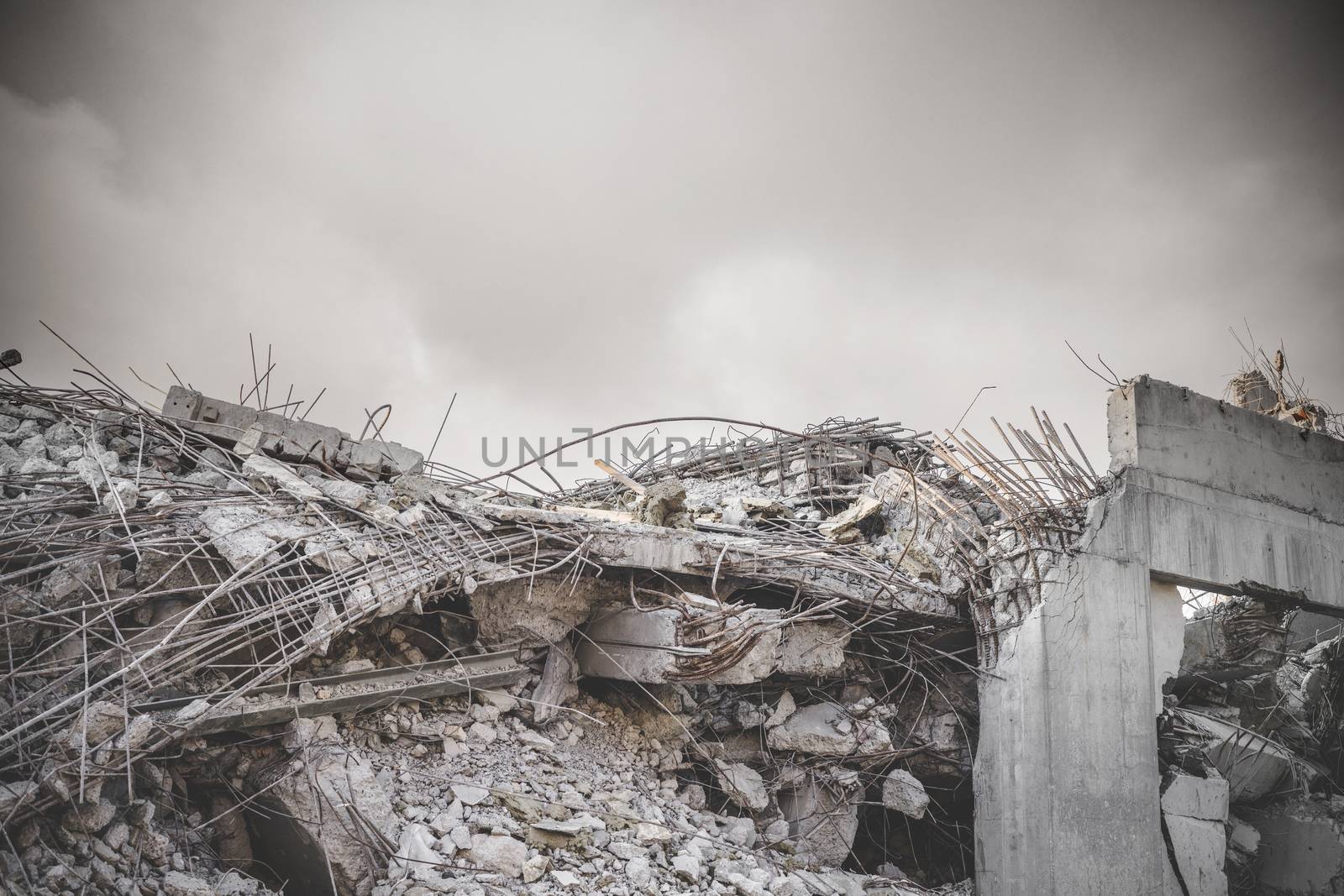 Ruin in a war zone with a damaged concrete building  by Sportactive