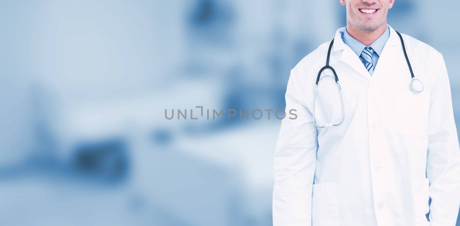 Portrait of male doctor smiling against dental equipment