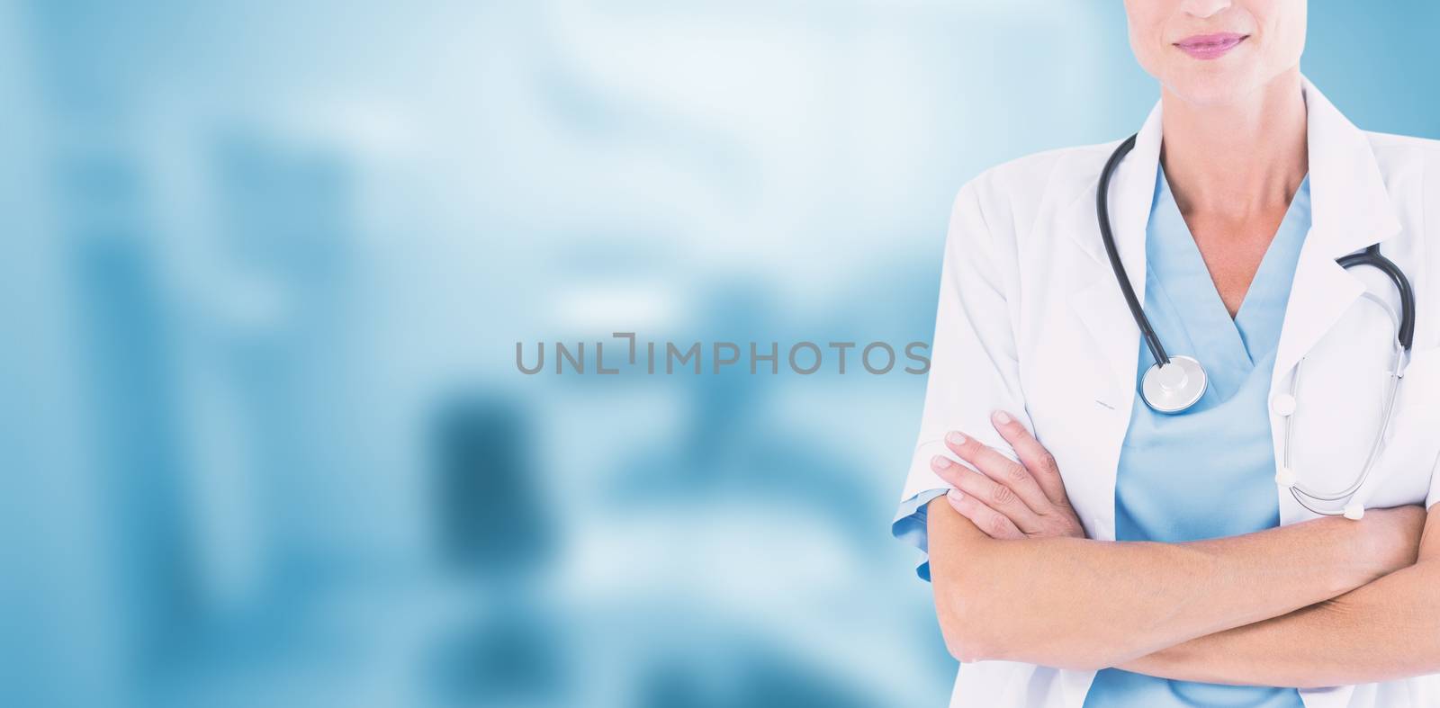 Beautiful doctor standing arms crossed against dental equipment