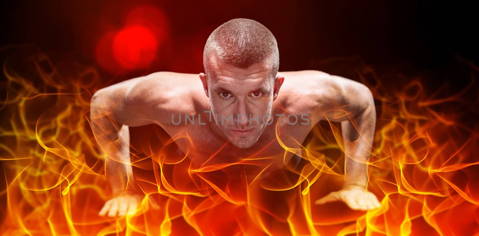 Confident shirtless athlete doing push ups against abstract orange glowing black background