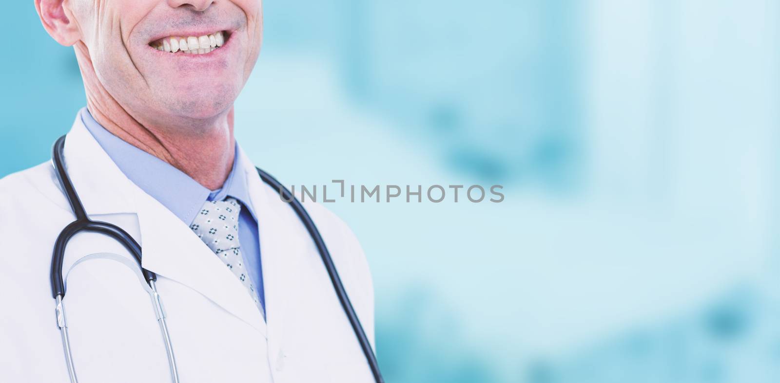 Portrait of male doctor smiling against dental equipment
