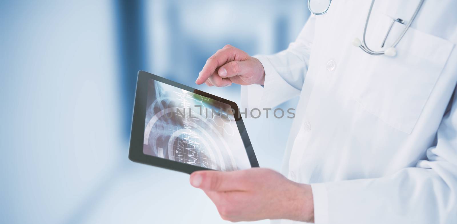 Composite image of doctor using digital tablet by Wavebreakmedia