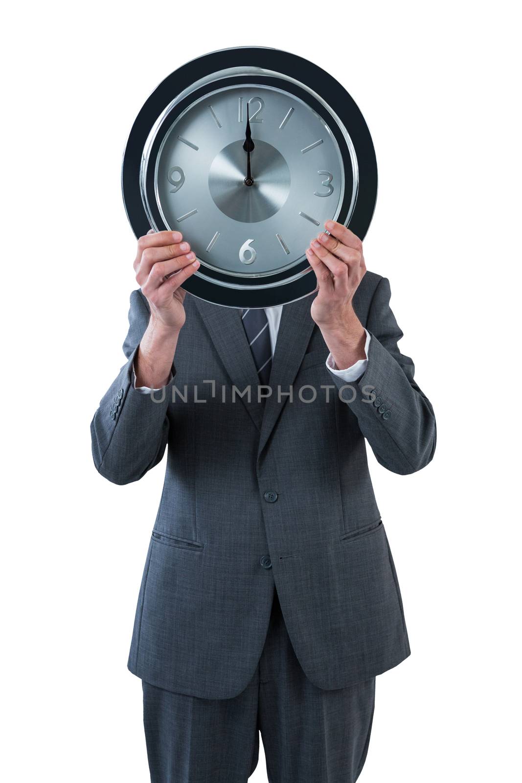 Businessman holding a clock in front of his face against white background