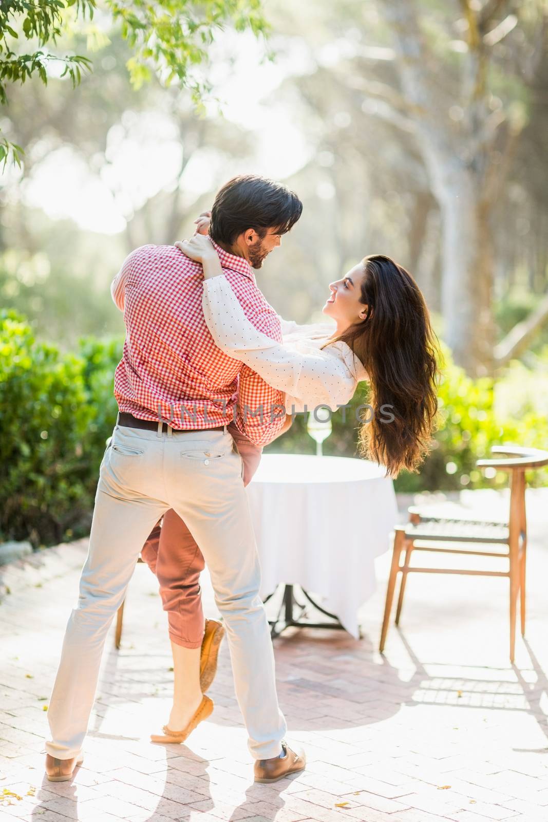 Close-up of couple dancing in the park