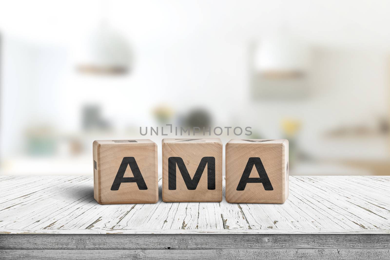 AMA ask me anything message made of wood in a bright room on a desk