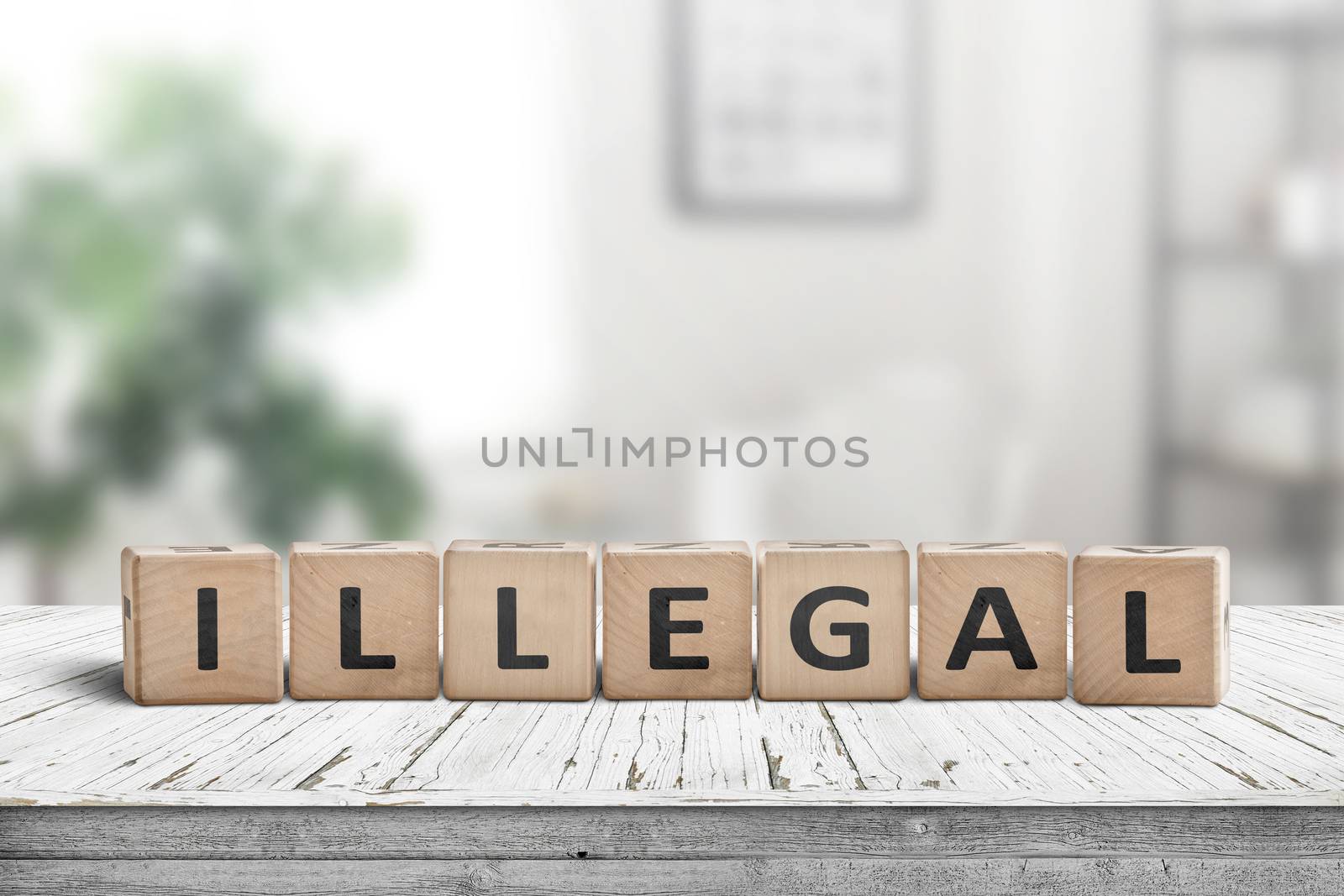Illegal message on a wooden desk in a bright living room in daylight