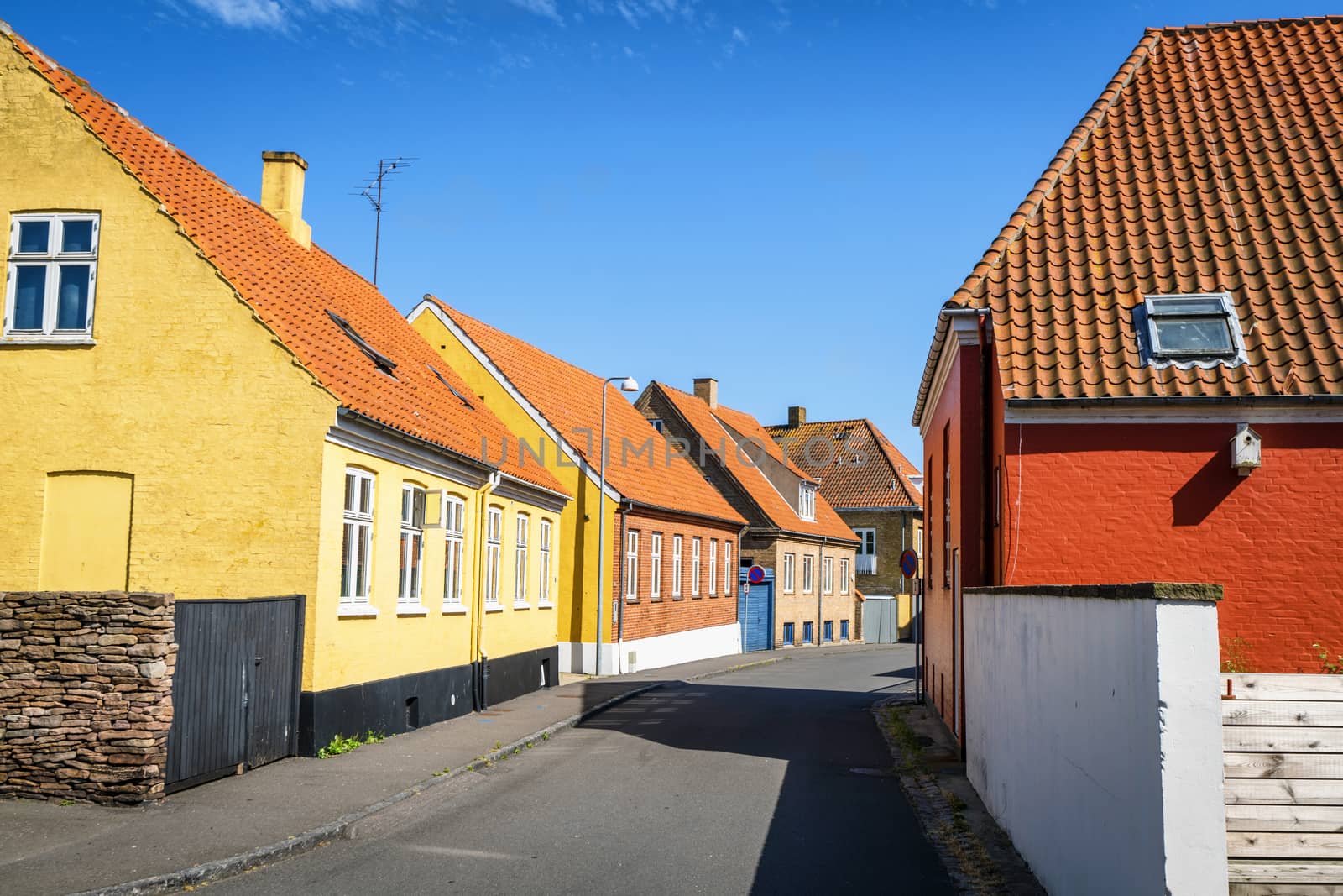 Danish city streets with colorful buildings on the island of Bornholm in the summer