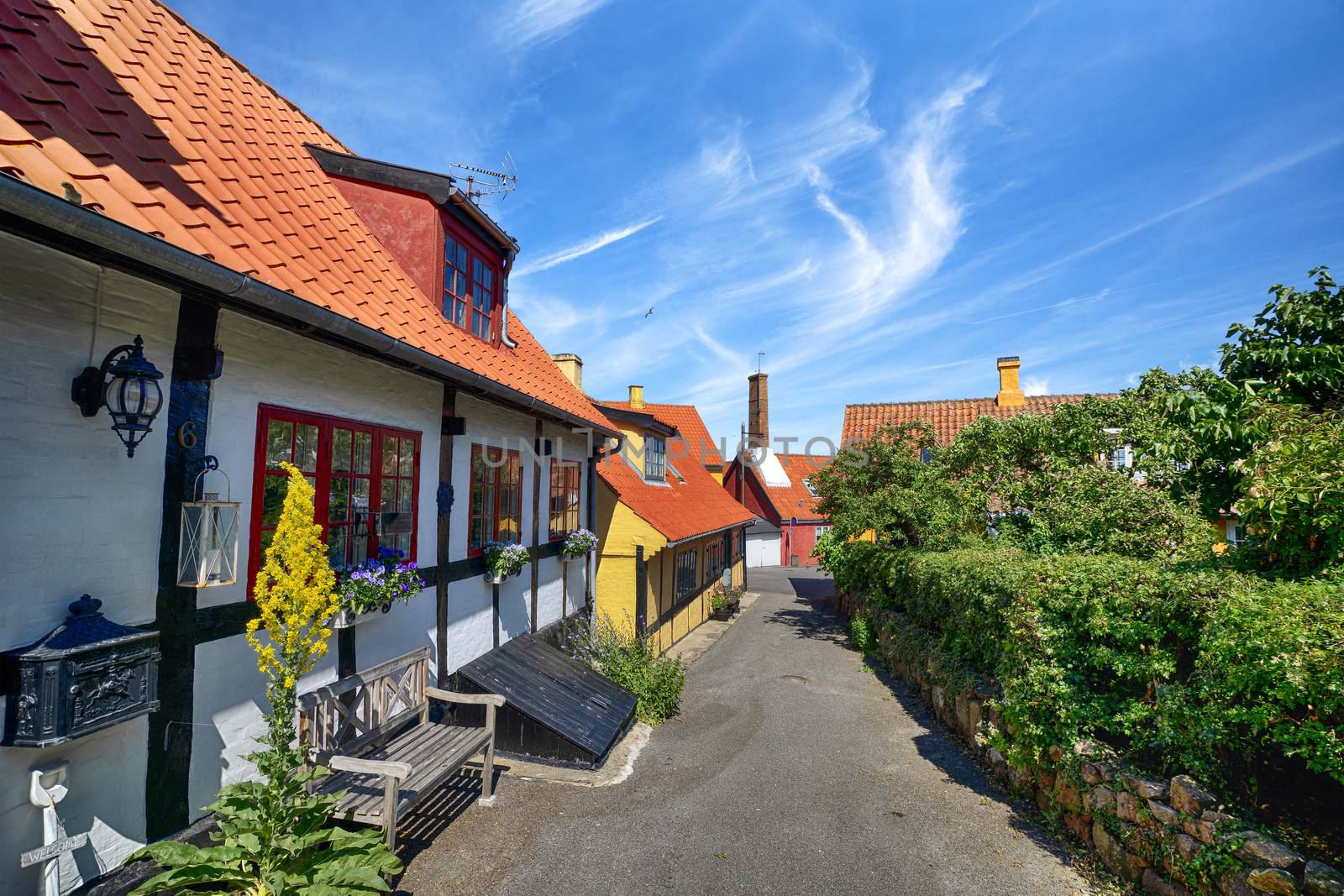 Scandinavian street in a small village in the summer with colorful buildings under a blue sky